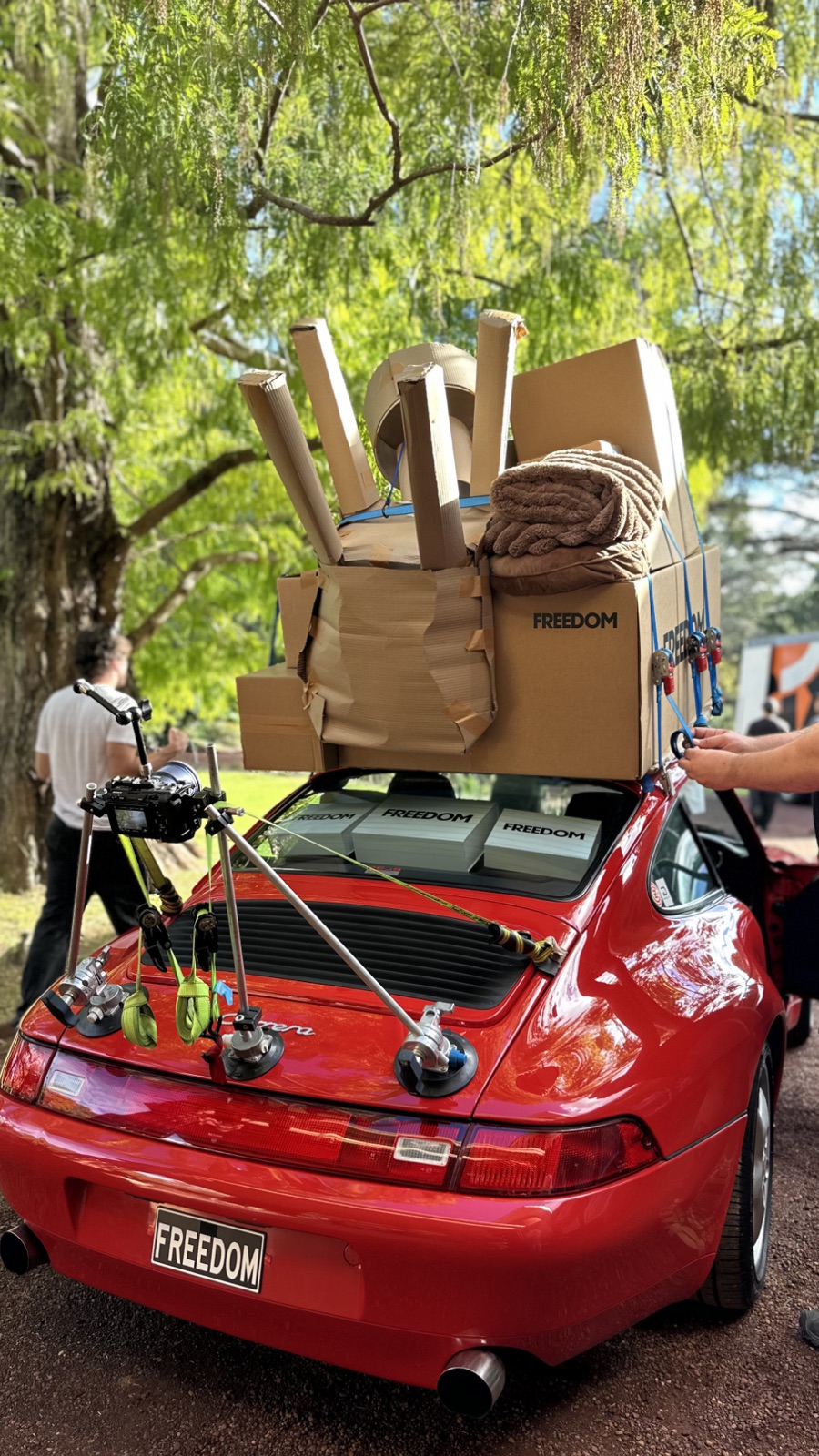 The FREEDOM-plated Porsche loaded with the box tower, camera rigged on the boot